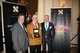 Fragrance Du Bois and Asia Plantation Capital Chief Executive Officer, Gary Crates, with the winner of the Price Prediction Game, Mr Khaled Diab and Asia Plantation Capital Geneva Channel Manager, Patrick Castagna.