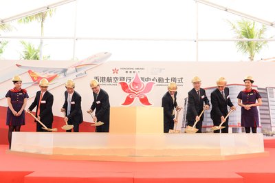 Mr. Norman Lo Shung-man, Director-General of Civil Aviation; Mr. Fred Lam Tin-fuk, Chief Executive Officer of Airport Authority Hong Kong; Prof. the Hon. Anthony Cheung Bing-leung, Secretary for Transport and Housing; Mr. Zhang Kui, President of Hong Kong Airlines; Mr. Joseph Lai Yee-tak, Permanent Secretary for Transport and Housing (Transport); the Hon. Frankie Yick Chi-ming, member of the Legislative Council (Transport Functional Constituency), officiate the groundbreaking ceremony (from left to right).