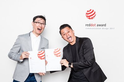 Security Master's senior UI designer Kai Lin [left] and senior visual designer Jason Yang [right] pose with their Red Dot Awards