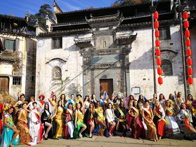 Miss Tourism Queen of the Year International Tour Lands in Chinese Village of Huangling.