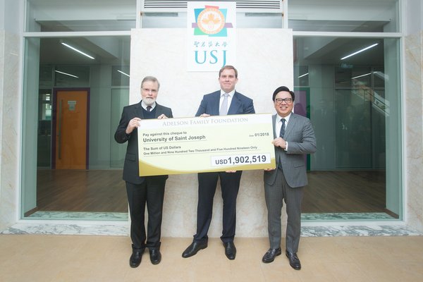 Las Vegas Sands and Sands China executives present a US$1.9 million cheque to the University of Saint Joseph on behalf of the Adelson Family Foundation on Tuesday. The donation will help support the university’s recovery efforts after Typhoon Hato caused major damage to its new campus in August.Left to right: Fr. Peter Stilwell, rector, University of Saint Joseph; Patrick Dumont, executive vice president and chief financial officer, Las Vegas Sands Corp.; Dr. Wilfred Wong, president, Sands China Ltd.
