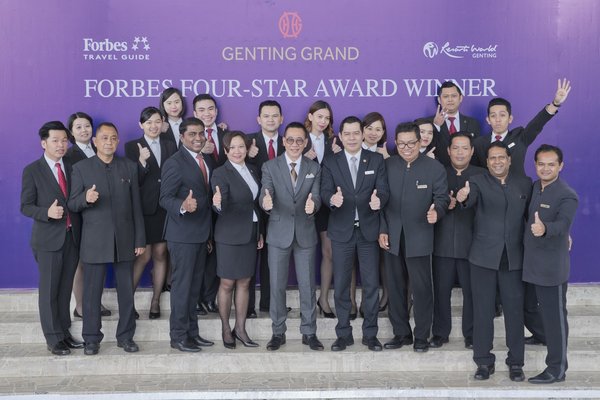 Mr. Victor Foo, Vice President of Hotel Operations (center front row in gray) with the frontliners of Genting Grand Hotel