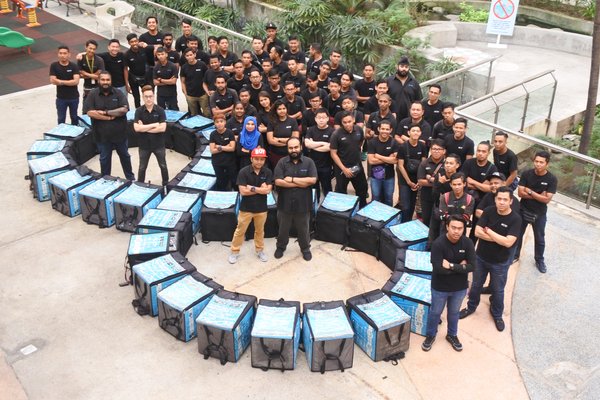 Co-founders (from left to right ) Jeevan Kumar, Sean Lee, Mohd Hafiz, & Devan Kumar ( standing at the circle) and their fleet of Zoomers