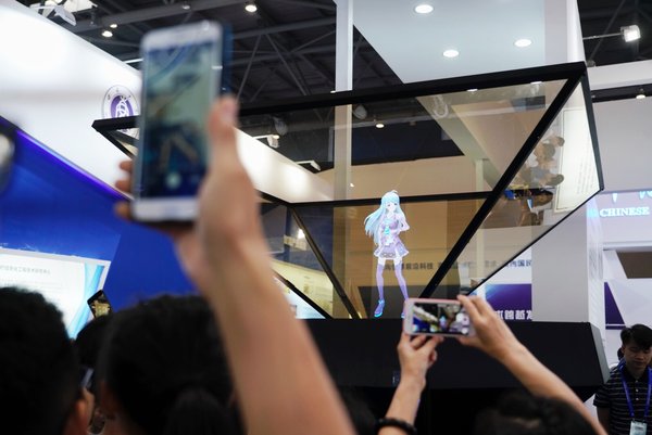 Holographic Imagining Technology Draws Eager Attention at Smart China Expo Exhibition Hall.