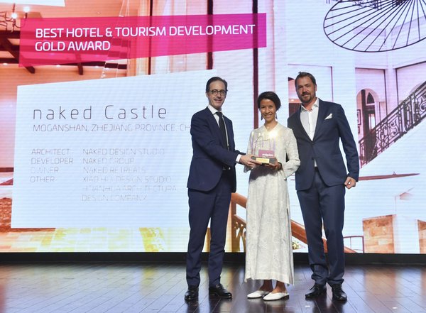 naked Founder Grant Horsfield and co-chairman Delphine Yip-Horsfield accepted the Award