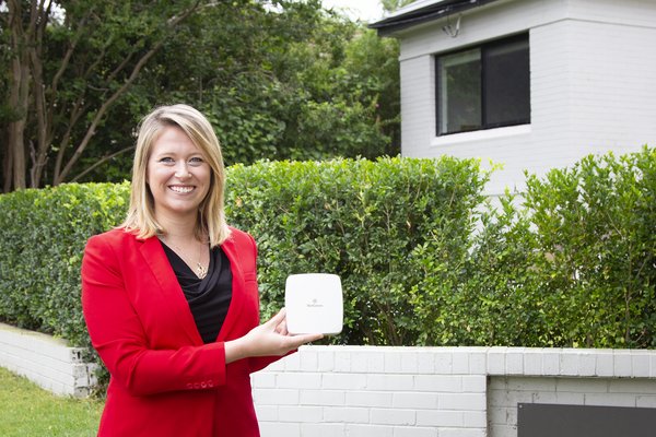 Els Baert, Director of Marketing & Communications at NetComm, pictured with one of NetComm's 5G Self-Install antennae.