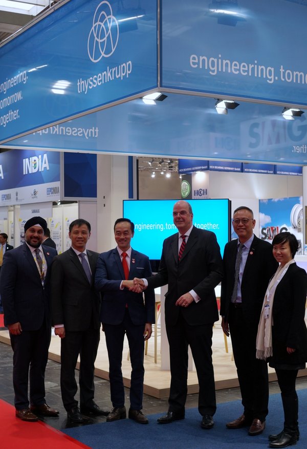 (2nd from L; L to R) Mr. Laurence Bay, Singapore Ambassador to Germany; Dr. Koh Poh Koon, Senior Minister of State for Trade and Industry; Dr. Donatus Kaufmann, Board Member of thyssenkrupp AG; Mr. Lim Kok Kiang, Assistant MD EDB; and the EDB team, at the announcement at Hannover Messe 2019
