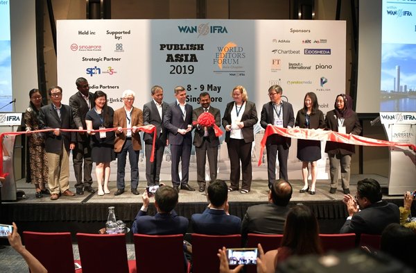 Media leaders from the region cutting a red ribbon on stage during the launch ceremony of the World Editors Forum Asia chapter. PHOTO: THE STRAITS TIMES
