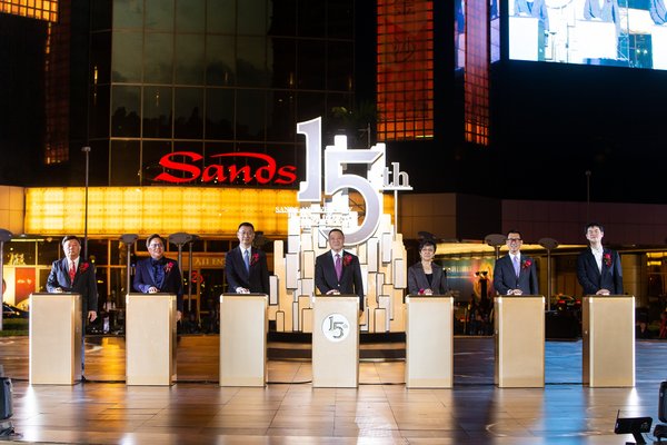 Guests of honour officiate the 15th anniversary celebration for Sands Macao Thursday at the hotel and entertainment complex’s outdoor fountain.