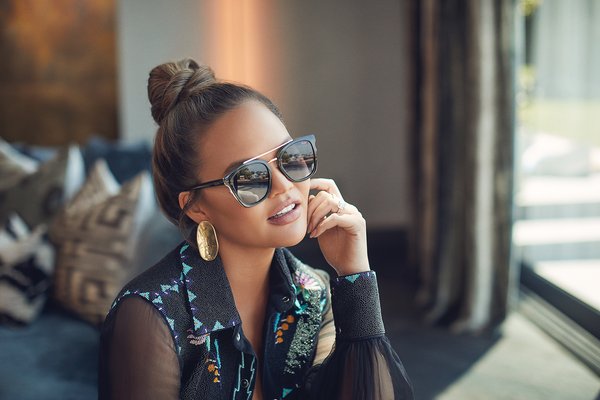 Chrissy Teigen wears Quay Australia ‘Sweet Dreams’ Sunglasses.