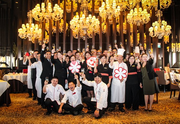 Executive Chef Chen Kentaro and his team at Mandarin Orchard Singapore celebrating their Michelin win