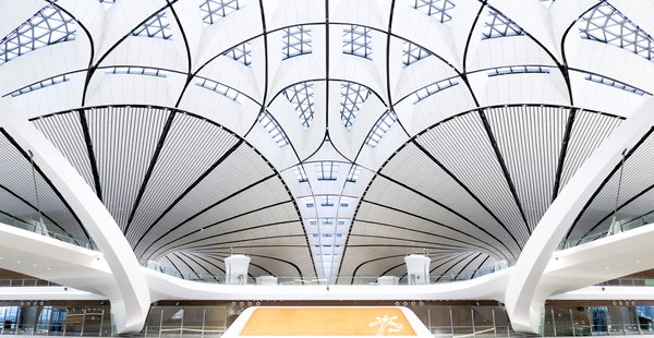 The well-lit atrium of the Beijing Daxing Internatinal Airport