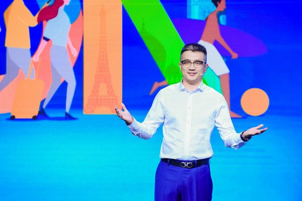 Trip.com Group CMO Bo Sun (pictured) announces the promotion at the company's 