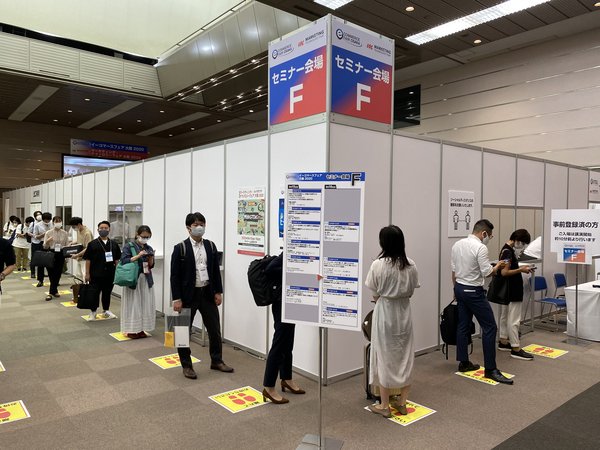 Eager delegates practice social distancing while queuing for seminars at eCommerce Osaka 2020