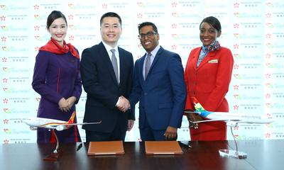 Manoj Papa, Chief Executive Officer of Air Seychelles, and Li Dianchun, Commercial Director of Hong Kong Airlines, sign a codeshare agreement between the two airlines