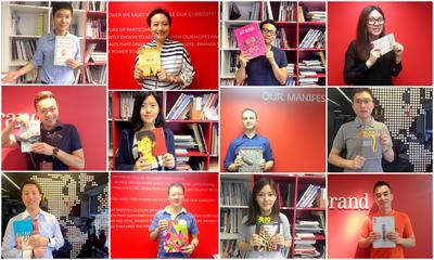 图为Interbrand中国办公室的员工参与“图书馆计划”的募捐活动的照片