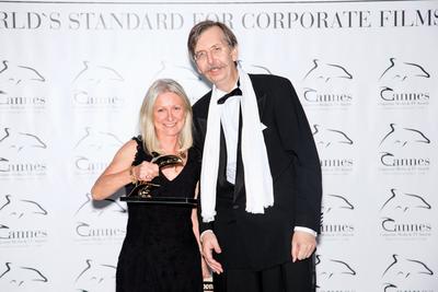 Tradition Well Served Director, Libby Halliday Palin (left), collects the Golden Dolphin Award at the Cannes Corporate and Media TV Awards on October 2, 2014. 