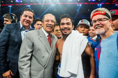 Manny Pacquiao celebrates his unanimous win over CHRIS ALGIERI after their 12-round WBO world welterweight title bout as part of the Clash in Cotai II at the Cotai Arena Sunday.