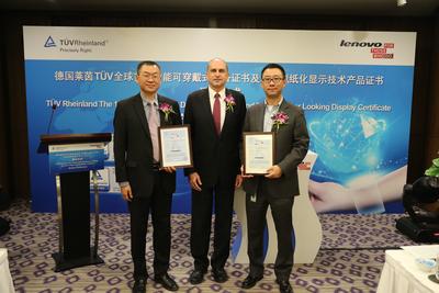 Mr. Uwe Halstenbach, Vice President & Managing Director, TUV Rheinland Greater China Electrical presents the world’s first Smart Wearable Device and Paper Looking Display Certificates to Lenovo