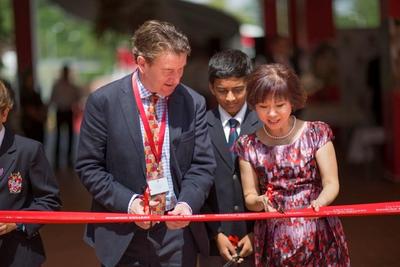 Dr. Amy Khor, Senior Minister of State for Ministry of Health and Ministry of Manpower, and Dr. Joseph Spence, Master of Dulwich College in London, preparing to cut the ribbon at Dulwich College Singapore’s inaugural Founder’s Day and official opening ceremony.