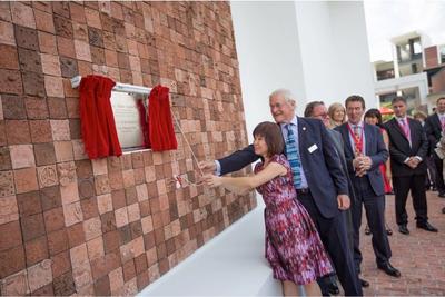 (From left to right) Dr. Amy Khor, Senior Minister of State for Ministry of Health and Ministry of Manpower, and Lord Turnbull, the Chairman of the Board of Governors at Dulwich College, unveil the inaugural Founder’s Day commemorative plaque, surrounded by 1,200 terracotta tiles handmade by every student, teacher and staff member from the first intake at Dulwich College Singapore.