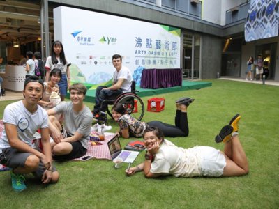 Artists and youths sharing their thoughts and laughter during the lawn picnic at "Arts Oasis @ Y Loft".