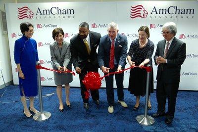 (From left to right) Singapore Ministry of Trade Director General for Trade and TPP Chief Negotiator Ng Bee Kim, AmCham Chairman James Andrade, U.S. Ambassador Kirk Wagar, and AmCham Executive Director Judith Fergin cut the ribbon with Ambassador-at-Large Chan Heng Chee (far left) and Ambassador-at-Large Tommy Koh as witnesses (far right).