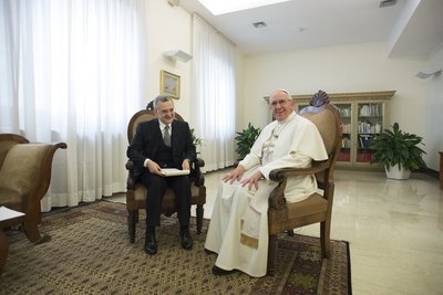 Francesco Sisci sitting with Pope Francis at the Vatican; Photo courtesy of the Vatican.