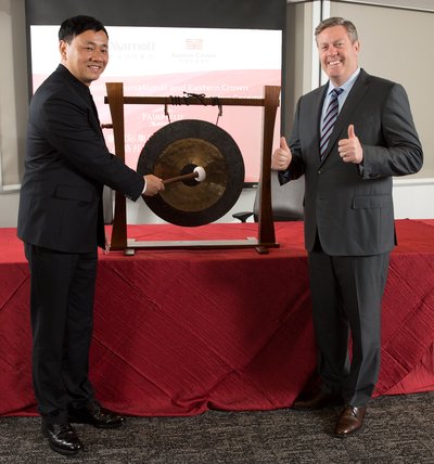 Mr. Cheng Xinhua (left), Founder, President and Chief Executive Officer of Eastern Crown Hotels Group and Craig S. Smith, President & Managing Director of Marriott International Asia Pacific (right) kick starting the collaboration by knocking the gong.