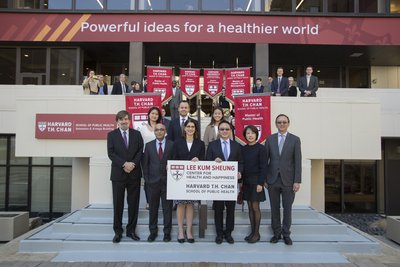 Group photo of representatives of the Lee Kum Kee family and Harvard faculty in front of the Harvard Chan School of Public Health