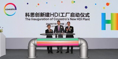 Mr. Xu Jianmin (left), Dr. Klaus Schafer (middle), and Mr. Daniel Meyer, start the valve, marking the official inauguration of Covesto's new HDI plant in Shanghai, China.