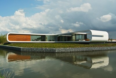 荷兰傍水别墅，由杜邦TM可丽耐®实体面材奶白色打造炫白外墙。 项目拍摄：Koen Olthuis – Waterstudio.NL，版权所有。