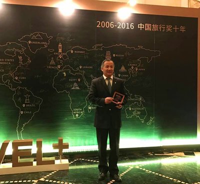 Mr. William Cai, Director of Sales & Marketing at Jin Jiang International Hotels, receiving the award