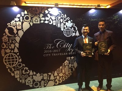 Senior Vice President of Jin Jiang International Hotel Management Company Mr. Kent Xia (left) is presented with the Best Local Hotel Brand award