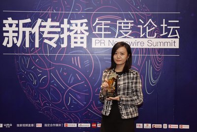 Ms. Shirley Lei, Manager of Marketing and Communications at Jin Jiang International Hotels, receiving the award