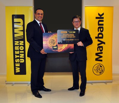 Bassem Awada, Western Union Vice President for Key Initiatives, Middle East, Africa, Asia Pacific, Eastern Europe and CIS (L) and Datuk Lim Hong Tat, Maybank Group Head, Community Financial Services (R) at the launch of Western Union Money Transfer Service via Maybank M2U Mobile App