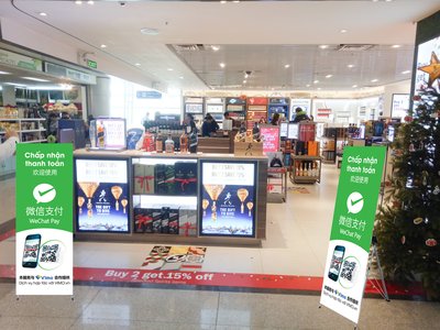 Chinese tourists can pay with Wechat at duty free shops having this sign at Tan Son Nhat -- Ho Chi Minh City's international airport