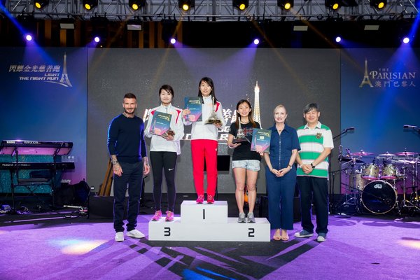 (Left) David Beckham; Female Group winners of the Full Run Competition at the first ever vertical race up The Parisian Macao’s 750-stair Eiffel Tower, Light The Night Run; (second from right) Ruth Boston, Senior Vice President, Marketing and Brand Management, Sands China Ltd. and (right) Hetzer Siu Yu Hong, CEO and National Director of Macau Special Olympics.