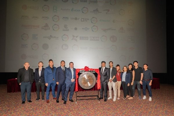 Sounding of gong by Olife C-Suite team, Advisory Board, and Management Team to officiate their listing on NCX Singapore