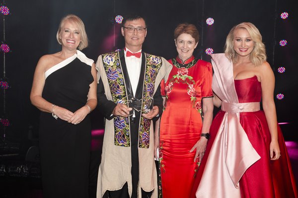Spectacular costumes were dazzling at the Melbourne Awards Gala Dinner on 17 November 2018 reflecting Melbourne's multicultural spirit: From left: Lord Mayor Sally Capp, Award Winners Chin Communications Managing Director Charles Qin OAM and CEO Kate Ritchie, and Jane Bunn, Channel 7 host.