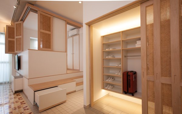 Raised bedroom and hidden storage for space efficiency