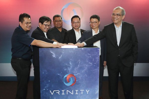 Kim Hoon-Bae, head of KT's New Media Business Unit (second from left), YB Jimmy Puah Wee Tse, chairman of investment and utilities committee, State international trade (third from right), Kim Young-woo, head of KT's Global Business Group (second from right) and Datuk Ir. Khairil Anwar Ahmad, president and CEO of IIB (first from right) are photographed during the VRINITY opening ceremony at the Legoland shopping mall in the southern Malaysian state Johor on August 28.