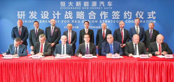 Evergrande New Energy Automobile Group signs a strategic agreement on vehicle R&D and design with German auto engineering and technology firms FEV Group, EDAG and IVA Group as well as Austria's AVL and Canada's Magna in Shenzhen, south China, Sept. 25.