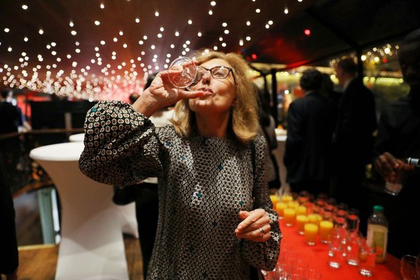 Martine Partrat, an executive from Air France, is tasting the Wuliangye wine.
