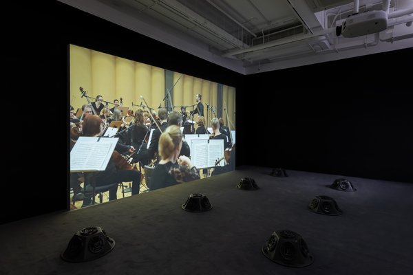 Muted Situations #22: Muted Tchaikovsky’s 5th 2018 HD video, eight-channel sound installation, and carpet 45 min. Courtesy of the artist Installation view, 2019. Image: Winnie Yeung @ iMAGE28 Courtesy of M+, Hong Kong