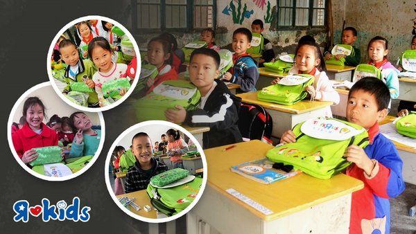 玩具反斗城向湖北和河南贫困地区捐赠书包文具套装，孩子们收到后露出了灿烂的笑容