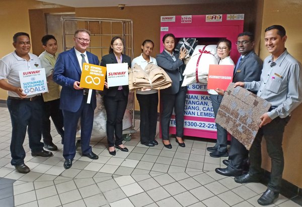 The Sustainable Committee of Sunway Hotels & Resorts recycling used and discarded fabric into the Kloth Cares Bin to keep fabrics out of landfills