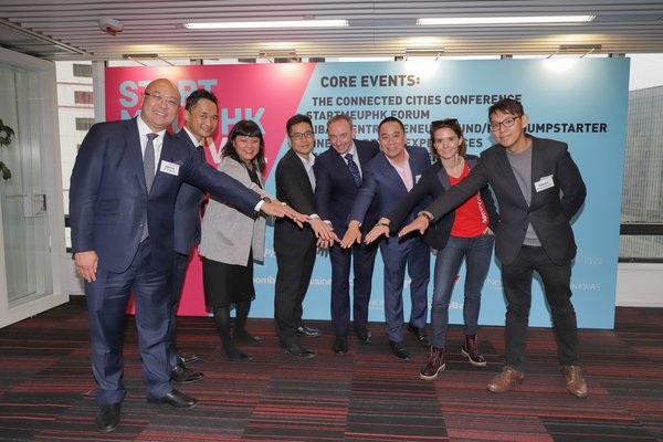 From left to right: Mr. Charles Ng (Associate Director-General of Investment Promotion, InvestHK), Mr. Alan Yau (Partner, Smart City Group, KPMG China), Ms. Jayne Chan (Head of StartmeupHK, InvestHK), Mr. Teddy Lui (Operations Director, Alibaba Entrepreneurs Fund), Mr. Stuart Bailey (Founder and CEO, Bailey Communications HK), Mr. James Kwan (Managing Director, Jumpstart Media), Ms. Karena Belin (CEO and Co-founder, WHub) and Mr. Alexander Chan (Co-director, The Mills Fabrica) join hands to anno